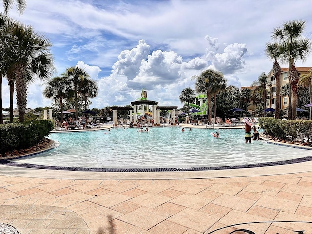 7675 Comrow St Unit 404, Kissimmee, FL 34747 - community pool featuring a patio