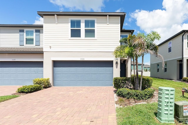 1024 Desert Candle Dr, Ocoee, FL 34761 - view of front of house with a garage and decorative driveway