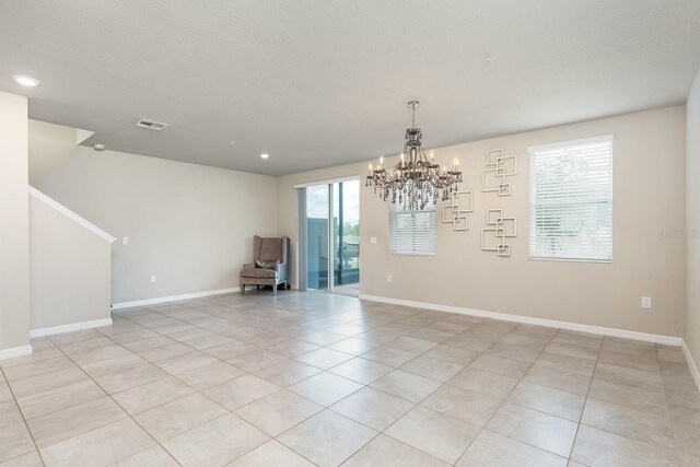 1024 Desert Candle Dr, Ocoee, FL 34761 - empty room featuring a chandelier, light tile patterned floors, and recessed lighting