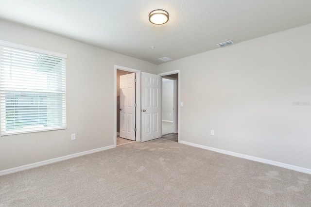 1024 Desert Candle Dr, Ocoee, FL 34761 - unfurnished bedroom featuring light carpet and baseboards