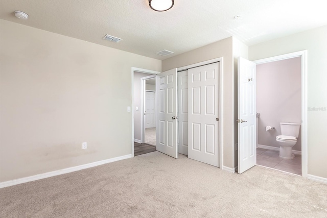 1024 Desert Candle Dr, Ocoee, FL 34761 - unfurnished bedroom featuring carpet floors, a closet, and connected bathroom