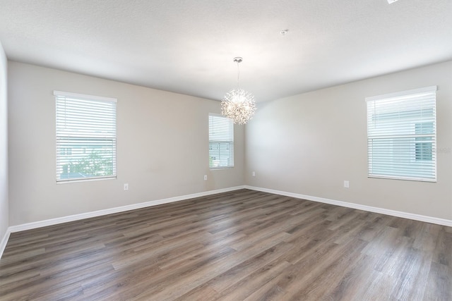 1024 Desert Candle Dr, Ocoee, FL 34761 - spare room with a chandelier and wood finished floors