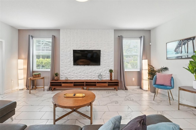 369 Ocean Course Ave, Davenport, FL 33896 - living room featuring marble look tile flooring and plenty of natural light