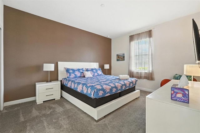 369 Ocean Course Ave, Davenport, FL 33896 - bedroom with dark colored carpet and baseboards