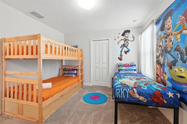 369 Ocean Course Ave, Davenport, FL 33896 - bedroom with carpet floors and a textured ceiling