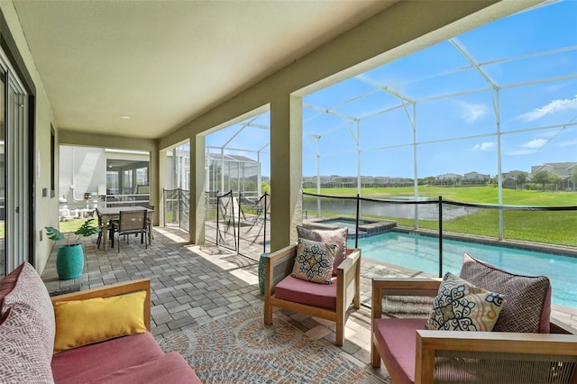 369 Ocean Course Ave, Davenport, FL 33896 - sunroom / solarium with a hot tub, a water view, and outdoor dining area