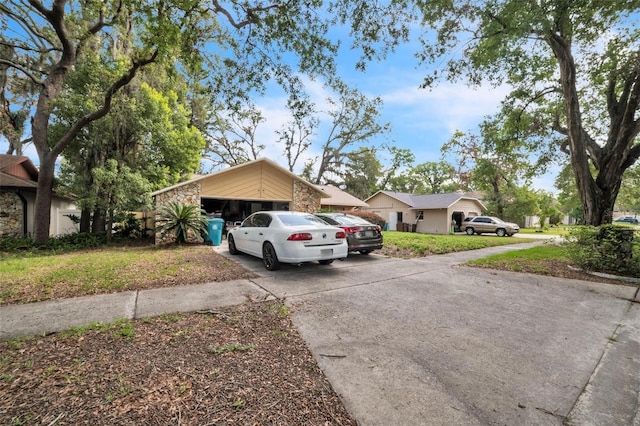 4799 Lighthouse Rd, Orlando, FL 32808 - mid-century modern home featuring driveway and stone siding