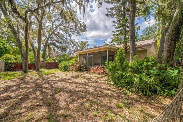 4799 Lighthouse Rd, Orlando, FL 32808 - view of yard with ceiling fan and a sunroom