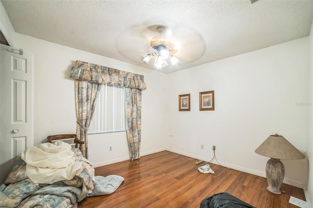 4799 Lighthouse Rd, Orlando, FL 32808 - bedroom with wood finished floors, a textured ceiling, and ceiling fan