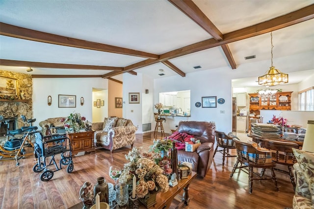 4799 Lighthouse Rd, Orlando, FL 32808 - living room with a chandelier, beam ceiling, and wood finished floors