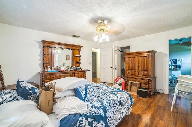 4799 Lighthouse Rd, Orlando, FL 32808 - bedroom featuring wood finished floors, a textured ceiling, and a ceiling fan