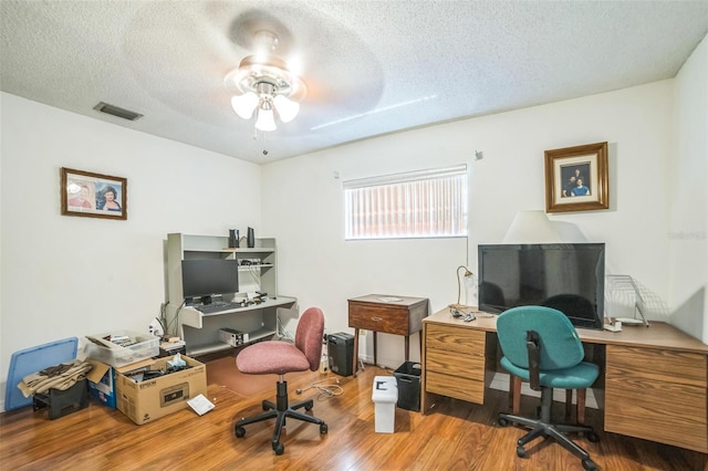 4799 Lighthouse Rd, Orlando, FL 32808 - office featuring a textured ceiling, wood finished floors, and ceiling fan