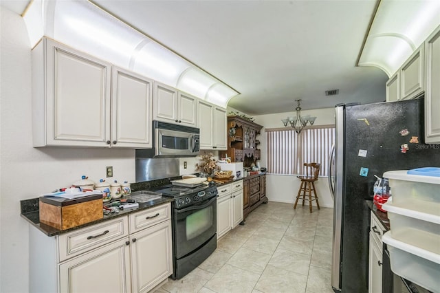 4799 Lighthouse Rd, Orlando, FL 32808 - kitchen featuring stainless steel appliances and a chandelier