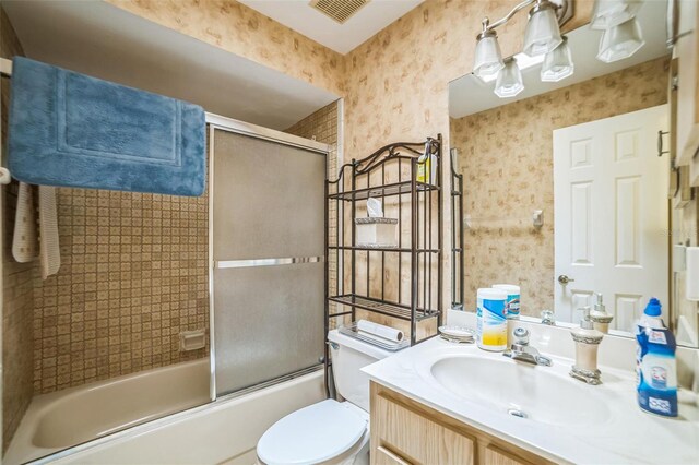 4799 Lighthouse Rd, Orlando, FL 32808 - bathroom with vanity, bath / shower combo with glass door, and wallpapered walls