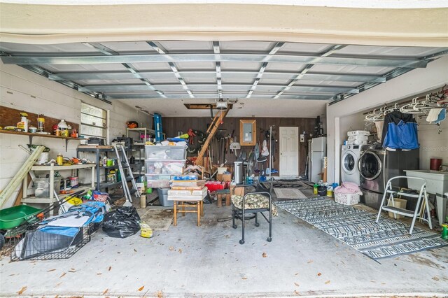 4799 Lighthouse Rd, Orlando, FL 32808 - garage featuring washer and dryer, freestanding refrigerator, and electric panel