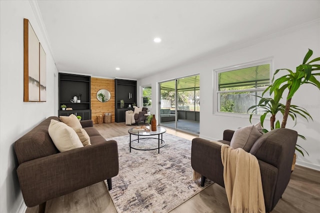 1505 N Lake Mirror Dr NW, Winter Haven, FL 33881 - living area featuring ornamental molding, wood finished floors, recessed lighting, and built in features