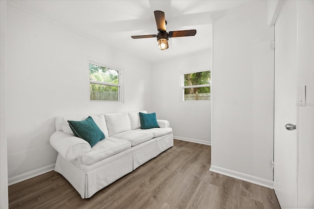 1505 N Lake Mirror Dr NW, Winter Haven, FL 33881 - living room with healthy amount of natural light, wood finished floors, and a ceiling fan