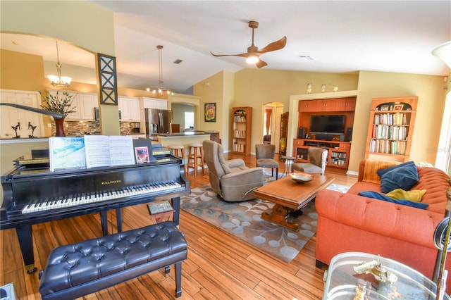 5769 E Price Blvd, North Port, FL 34288 - living room featuring arched walkways, ceiling fan, light wood-style flooring, and lofted ceiling