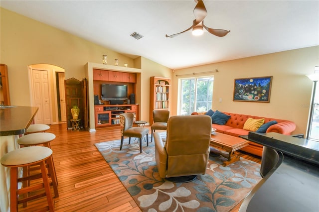 5769 E Price Blvd, North Port, FL 34288 - living room featuring ceiling fan, wood finished floors, and vaulted ceiling