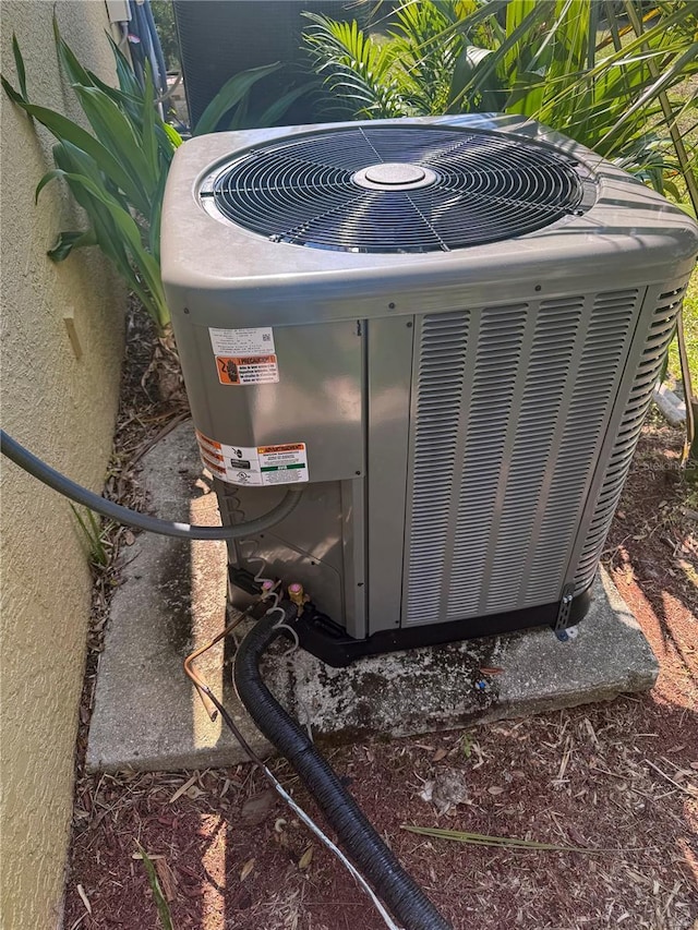 5769 E Price Blvd, North Port, FL 34288 - exterior view of a central AC unit and stucco siding
