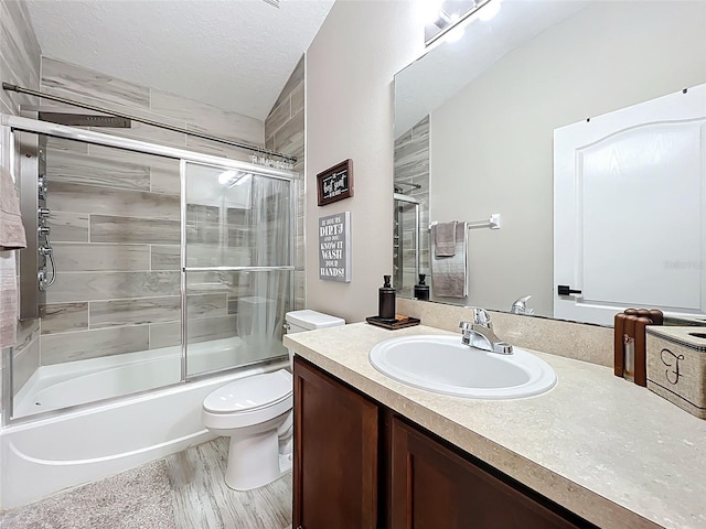725 Ashworth Overlook Dr Unit C, Apopka, FL 32712 - bathroom with vanity, bath / shower combo with glass door, and a textured ceiling