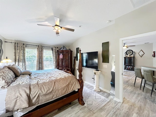 725 Ashworth Overlook Dr Unit C, Apopka, FL 32712 - bedroom featuring light wood-style flooring, vaulted ceiling, and a ceiling fan