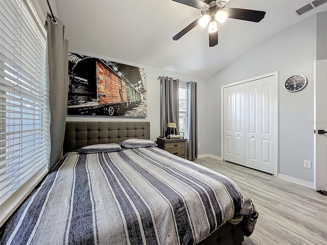 725 Ashworth Overlook Dr Unit C, Apopka, FL 32712 - bedroom featuring vaulted ceiling, wood finished floors, a closet, and ceiling fan