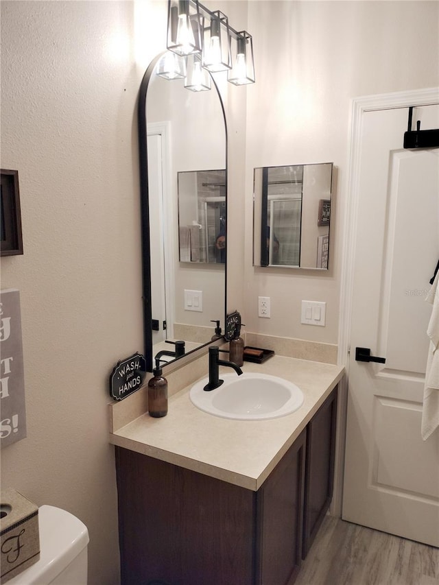725 Ashworth Overlook Dr Unit C, Apopka, FL 32712 - bathroom featuring vanity and wood finished floors
