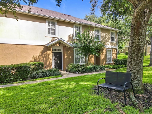 725 Ashworth Overlook Dr Unit C, Apopka, FL 32712 - view of front of property featuring stucco siding and a front yard