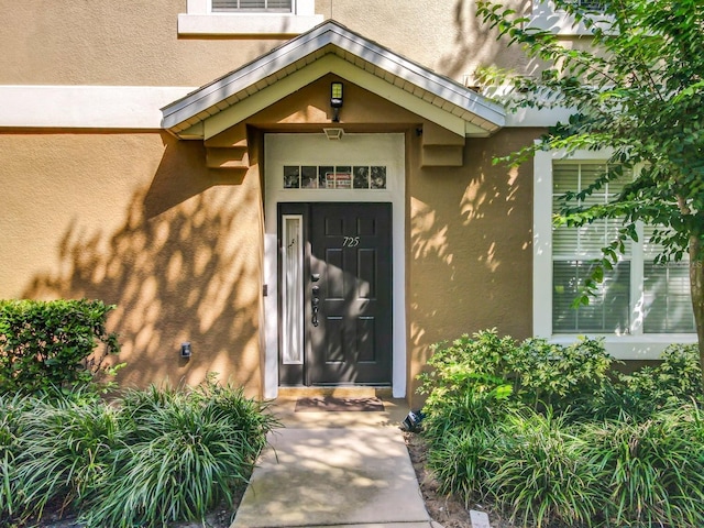 725 Ashworth Overlook Dr Unit C, Apopka, FL 32712 - property entrance featuring stucco siding