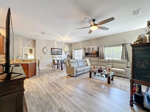 725 Ashworth Overlook Dr Unit C, Apopka, FL 32712 - living room with ceiling fan and light wood finished floors
