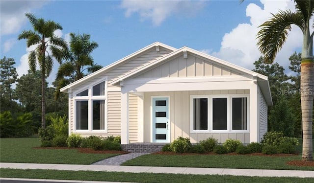 2971 Embark Trl, Saint Cloud, FL 34771 - view of front of property with board and batten siding and a front lawn