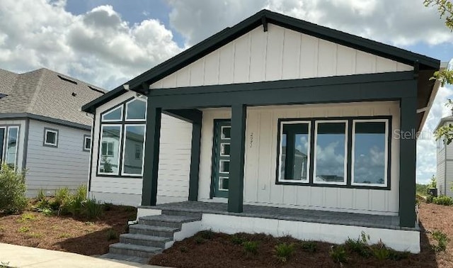 2971 Embark Trl, Saint Cloud, FL 34771 - view of front facade featuring covered porch and board and batten siding