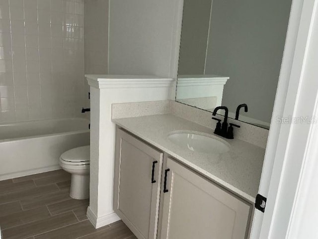 2971 Embark Trl, Saint Cloud, FL 34771 - bathroom featuring vanity, wood finished floors, and bathtub / shower combination