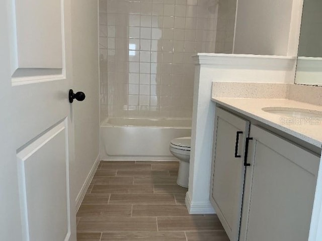 2971 Embark Trl, Saint Cloud, FL 34771 - full bathroom featuring vanity, wood finish floors, and washtub / shower combination