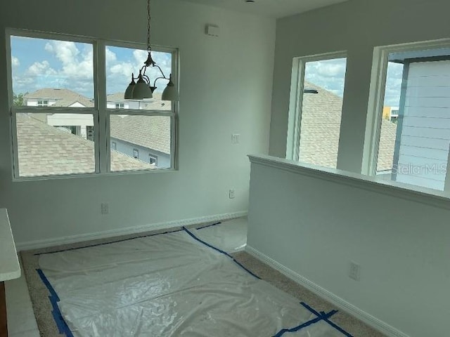 2971 Embark Trl, Saint Cloud, FL 34771 - unfurnished dining area featuring baseboards