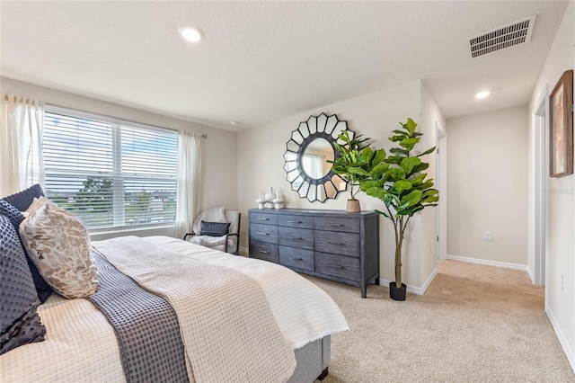 5645 Brosnan Rd, Saint Cloud, FL 34771 - bedroom featuring light carpet, a textured ceiling, and recessed lighting