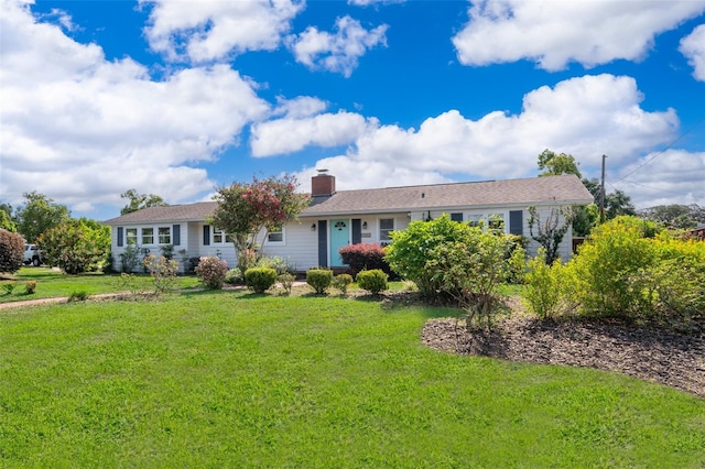1301 Fahnstock St, Eustis, FL 32726 - ranch-style house featuring a front yard and a chimney