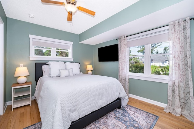 1301 Fahnstock St, Eustis, FL 32726 - bedroom featuring wood finished floors, multiple windows, and a ceiling fan