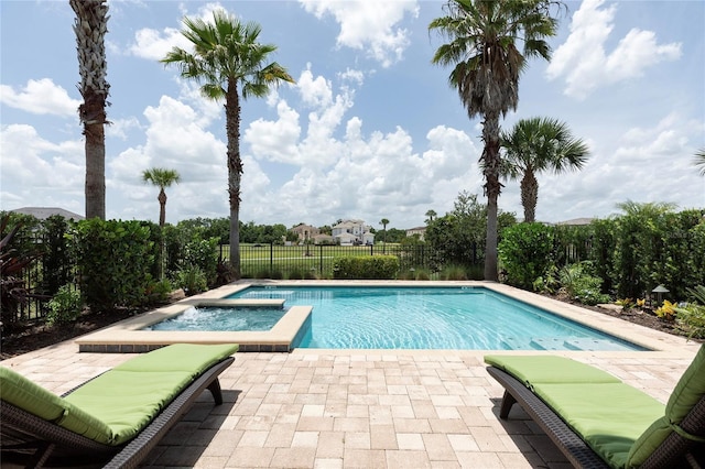 1156 Castle Pines Ct, Reunion, FL 34747 - view of pool with a patio, a fenced backyard, and a pool with connected hot tub