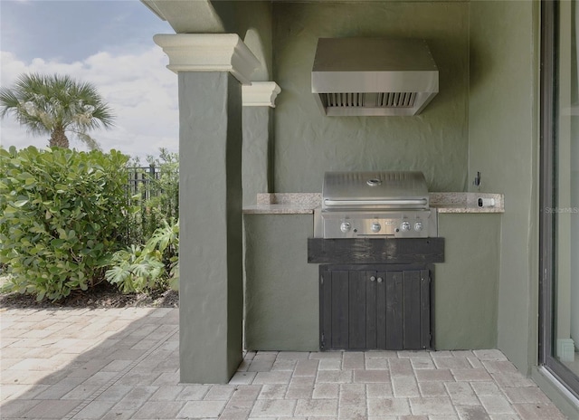 1156 Castle Pines Ct, Reunion, FL 34747 - view of patio with exterior kitchen
