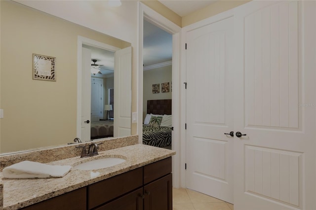 1156 Castle Pines Ct, Reunion, FL 34747 - bathroom with connected bathroom, vanity, tile patterned flooring, a ceiling fan, and ornamental molding