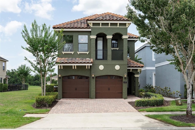 1156 Castle Pines Ct, Reunion, FL 34747 - mediterranean / spanish-style house with a tile roof, decorative driveway, stucco siding, and a garage