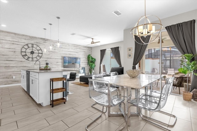 4802 Lullaby Ln, Kissimmee, FL 34746 - dining room featuring a chandelier, an accent wall, ceiling fan, and recessed lighting