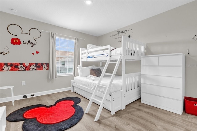 4802 Lullaby Ln, Kissimmee, FL 34746 - bedroom featuring wood finished floors and baseboards