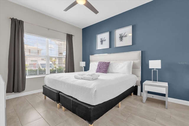 4802 Lullaby Ln, Kissimmee, FL 34746 - bedroom with a ceiling fan and tile patterned flooring