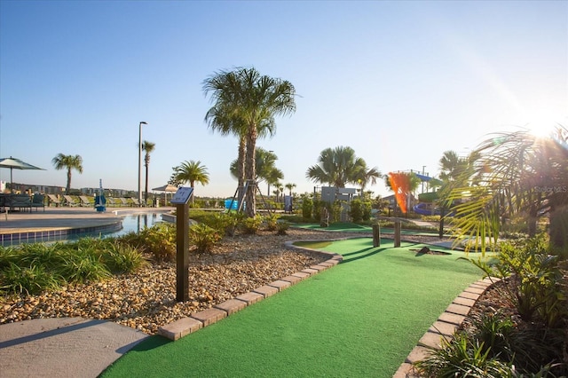 4802 Lullaby Ln, Kissimmee, FL 34746 - surrounding community featuring a putting green and a swimming pool