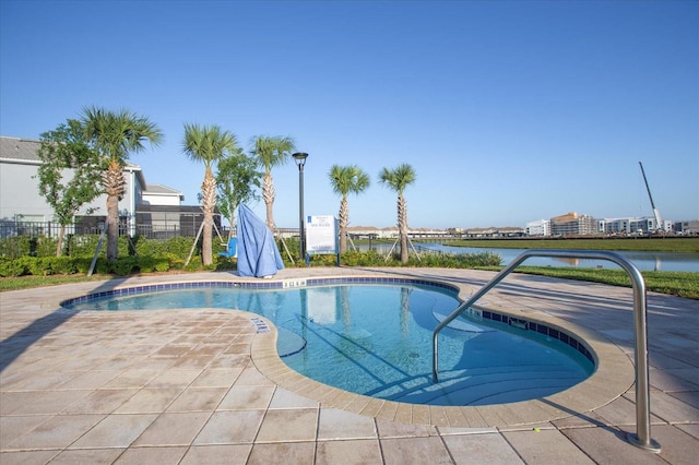 4802 Lullaby Ln, Kissimmee, FL 34746 - community pool featuring a patio area and a water view
