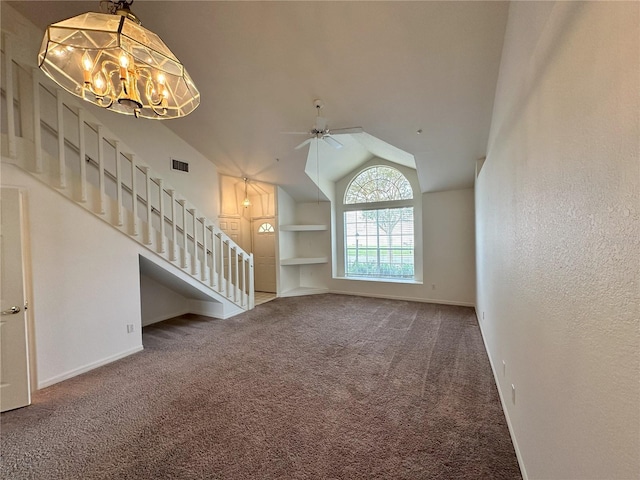 3352 Hamlet Loop, Winter Park, FL 32792 - unfurnished living room with built in shelves, stairway, a chandelier, carpet, and lofted ceiling