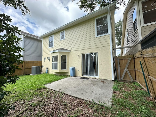 3352 Hamlet Loop, Winter Park, FL 32792 - back of house with a patio area, a fenced backyard, stucco siding, and a gate